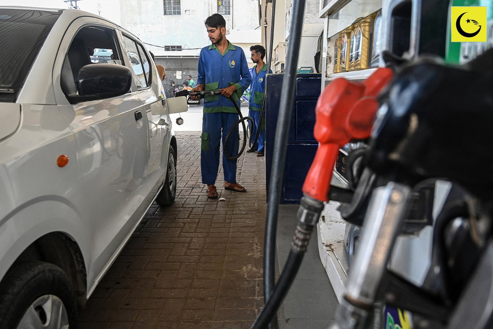 Petrol price Pakistan October 2026: a petrol station attendant filling a car at a pump in Pakistan