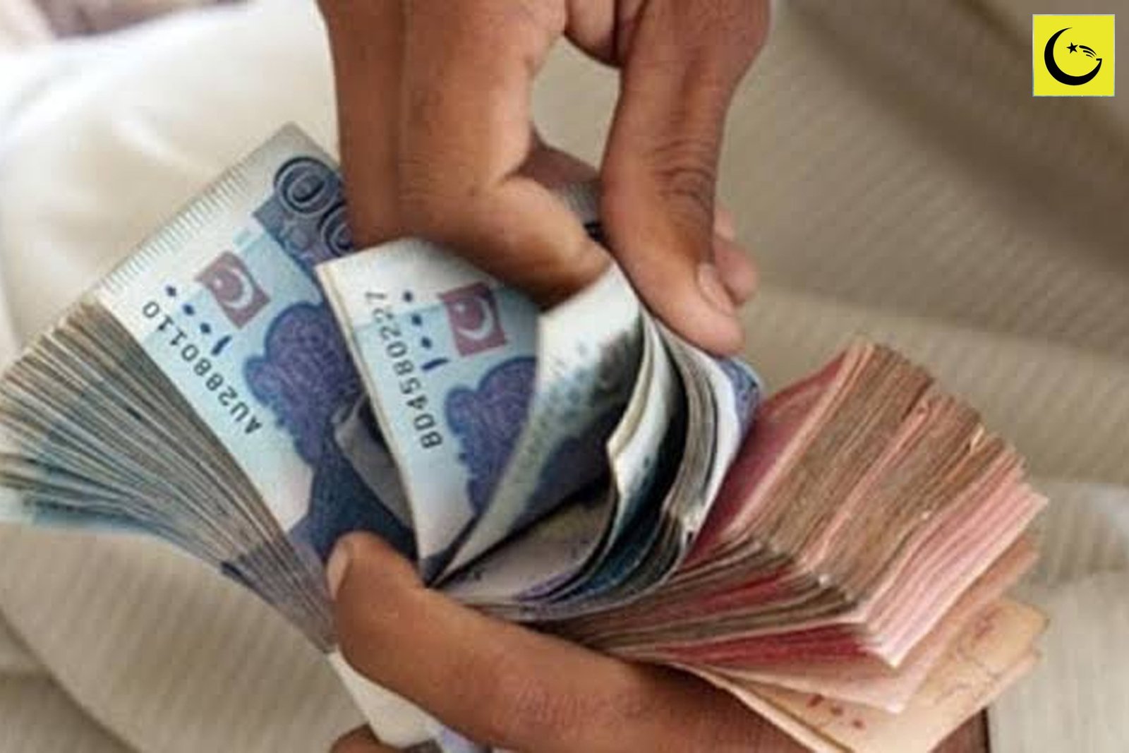 Pakistan remittances surge: hands counting Pakistani rupee banknotes sent home by overseas Pakistanis