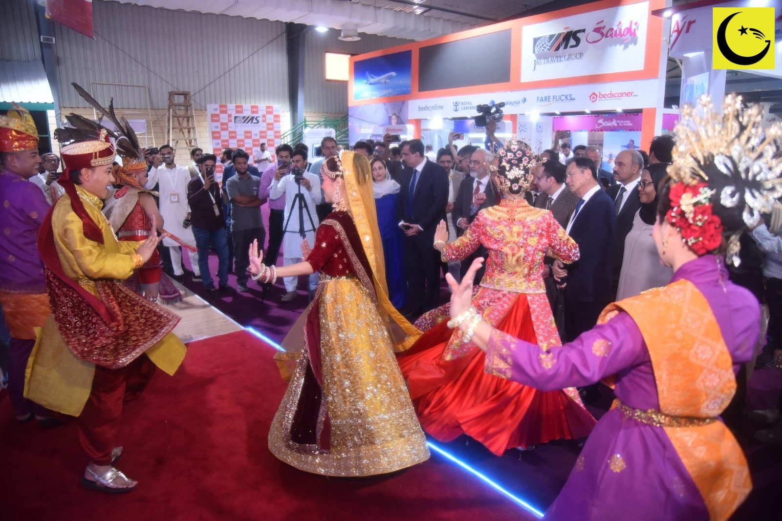 Pakistan Travel Mart 2026: cultural performers welcome visitors at the Malaysia Pavilion on the Karachi Expo Centre floor, April 2026