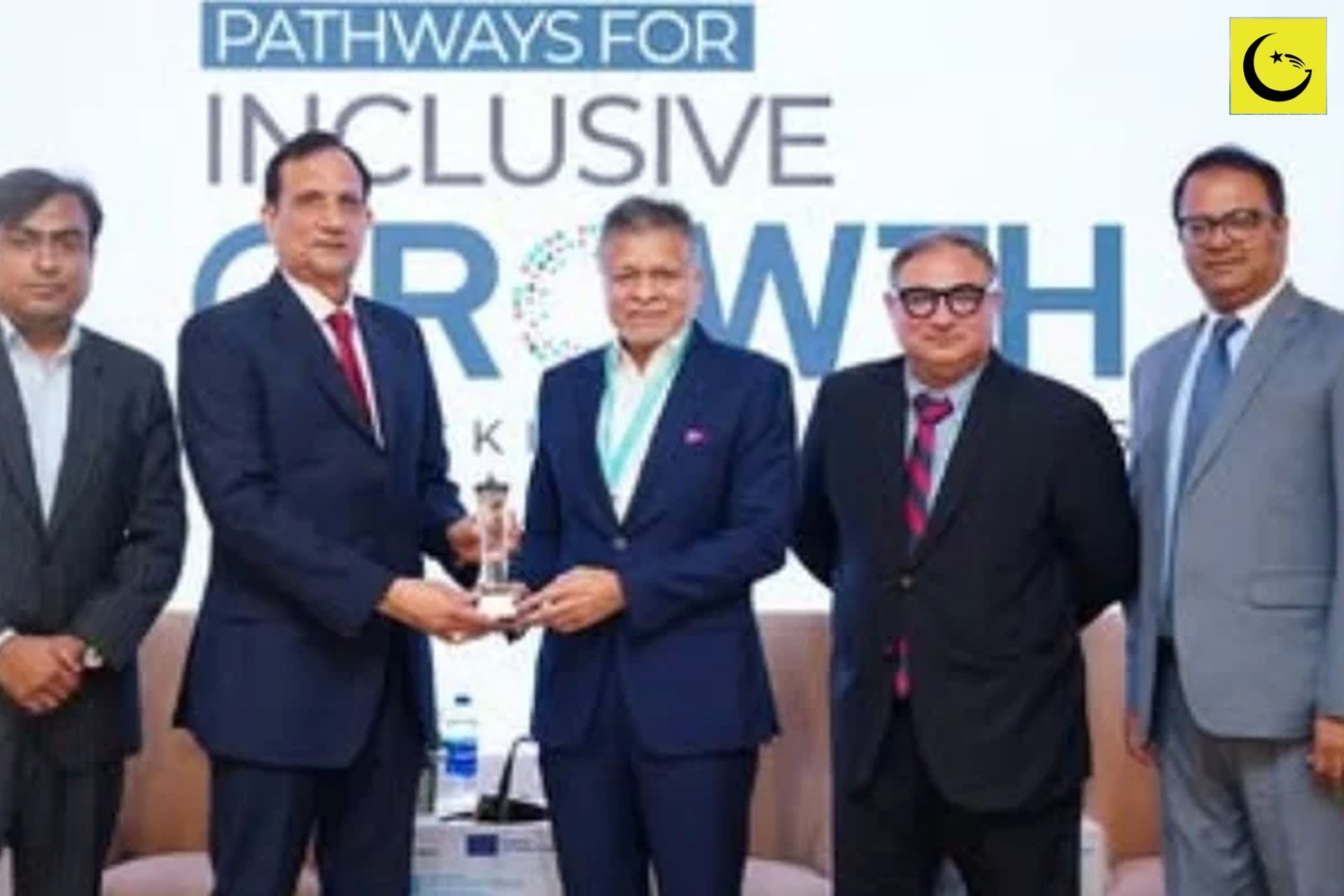 Khushhali Microfinance Bank representatives receiving the Khushhali Microfinance Bank awards at the PMN conference in Karachi
