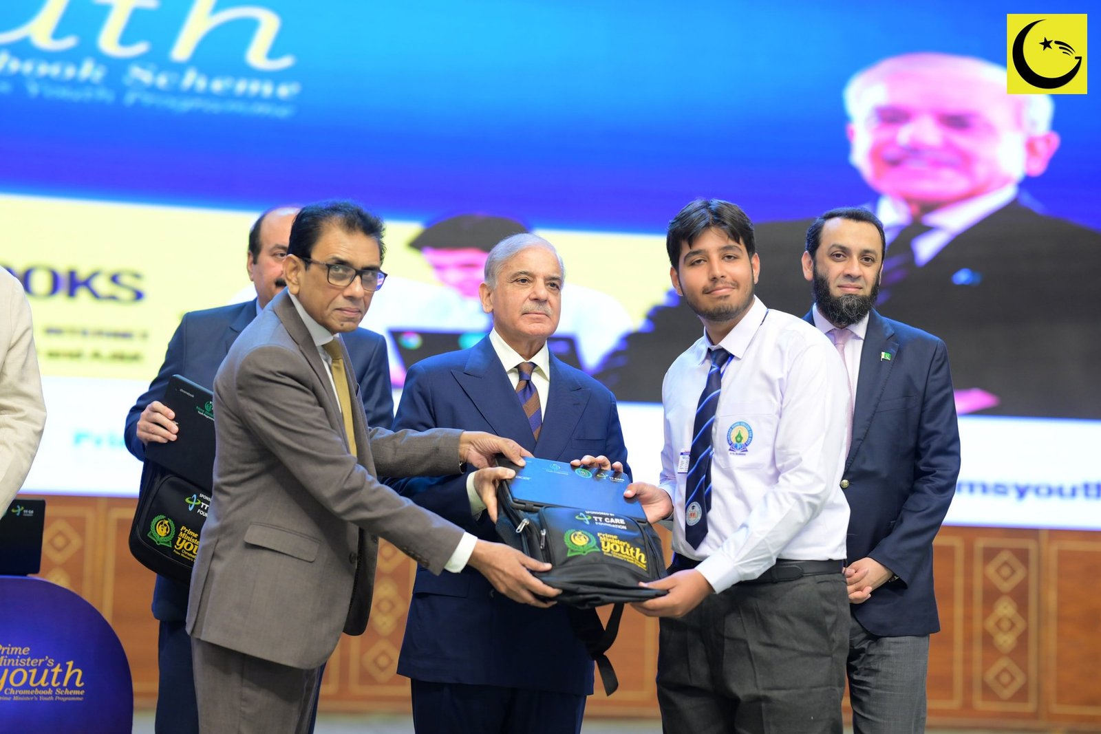 PM Youth Chromebook Scheme launch in Islamabad: Prime Minister Shehbaz Sharif hands a Chromebook kit to a student